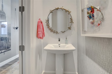 The conveniently located half bath, just off the e