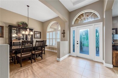 Decorative Glass Front Door and wide open FOYER wi