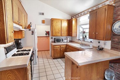 Spacious Kitchen with Breakfast Bar and Garden Window