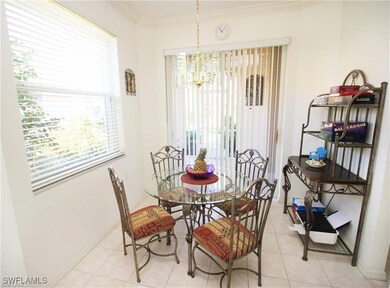 Dining space with crown molding, a wealth of natur