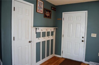 Coat closet and hooks for all the kids backpacks, 