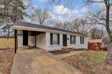 Ranch-style house featuring a carport
