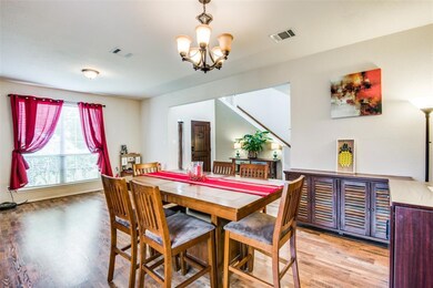 Beautiful wood-looking laminate floors throughout the downstairs, open floorplan and large windows create a warm and inviting downstairs space.