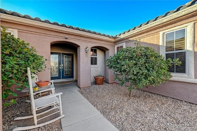 View of exterior entry with stucco siding and fren