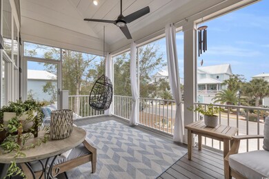Sunroom featuring ceiling fan and vaulted ceiling