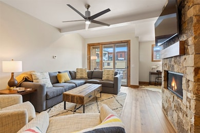 Living room with stone fireplace