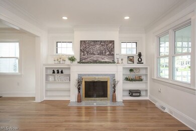 Living room, built in bookshelves and fireplace.