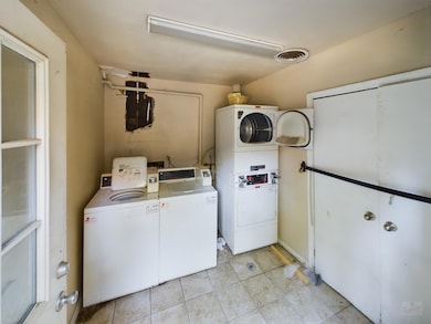 Community laundry room with washing machine and c
