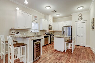 Bar seating, stainless steel appliances and walk i