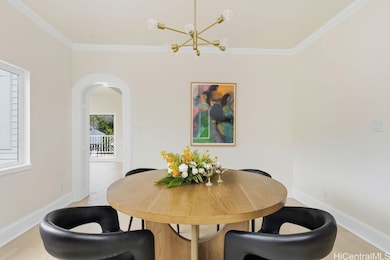 A formal dining room flows elegantly from the kitchen, setting the stage for candlelit dinners and lively conversation.