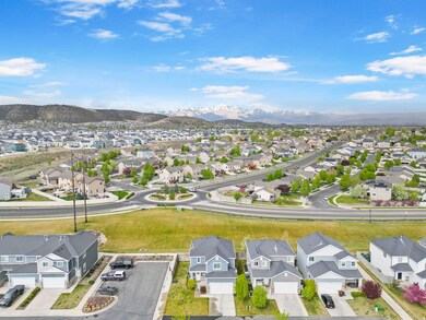 Aerial perspective of suburban area with a mountain backdrop