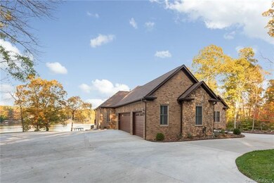 Oversized circular and gated driveway.