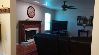 Living room with wood burning fireplace