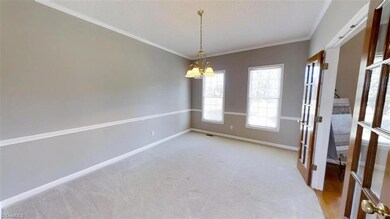 Solid wood french doors in the formal dining room.