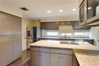 Kitchen  - New stainless steel appliances that rem