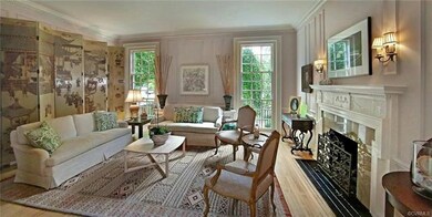 Living room with gas fireplace, Jefferson type triple tract windows