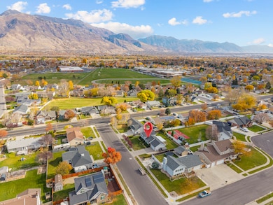 Aerial perspective of suburban area with a mountain backdrop