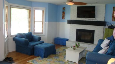 Living room w/fireplace and bay window