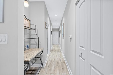 Hall featuring light hardwood / wood-style floorin