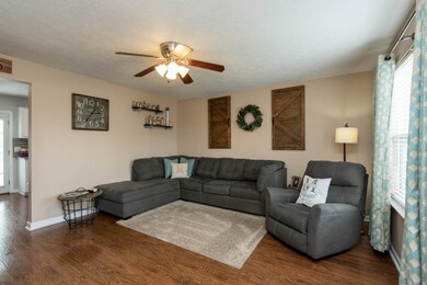 Lovely neutral colors and hardwood floors welcome you into this 14x14 living room. 