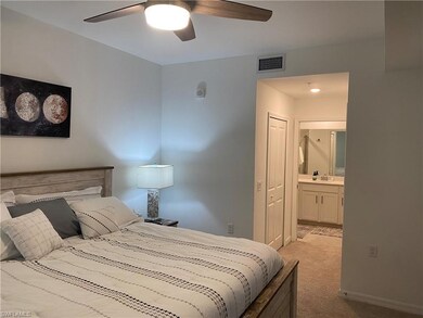 Bedroom with visible vents, a ceiling fan, light c