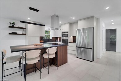 Kitchen with stainless steel appliances, modern ca