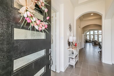 High ceilings and beautiful tile guide you through