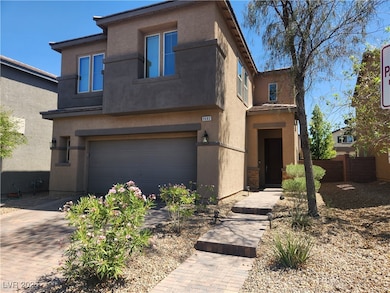 View of front of home featuring stucco siding, a g
