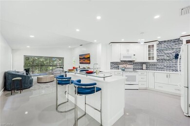 Kitchen featuring in-vogue backsplash, a breakfast