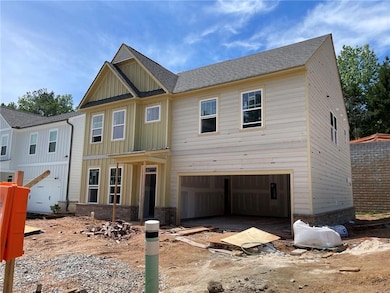 View of front facade with an attached garage, boar