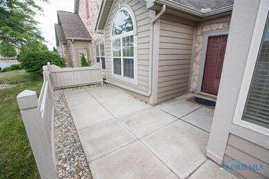 Front entrance and patio facing pond