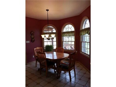 Kitchen. Breakfast nook overlooking back yard with