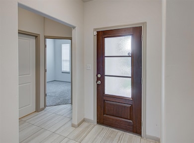 Entrance foyer featuring baseboards