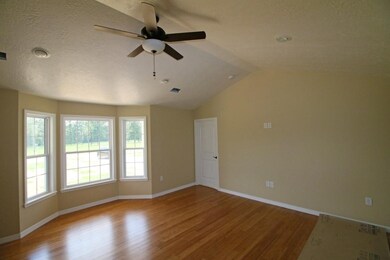 Living Room w/ bay window & vault