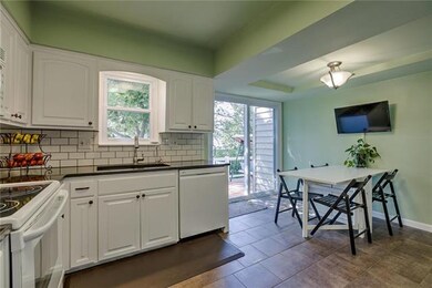 Plenty of room for eat-in kitchen.  Sliders to dec