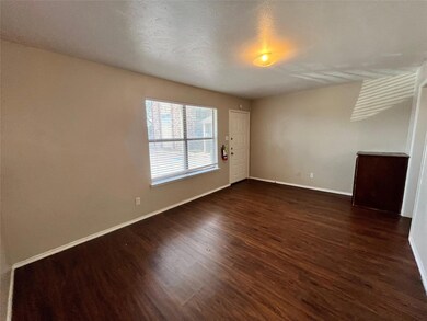 This living room has a built in cabinet and a larg