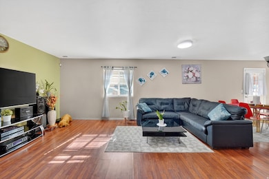 Living area featuring wood finished floors and baseboards