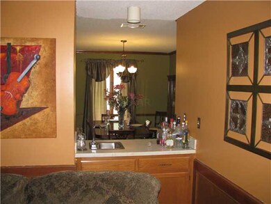 Wet bar separates Great Room And Dining Room
