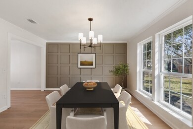 This dining room features large windows for natura