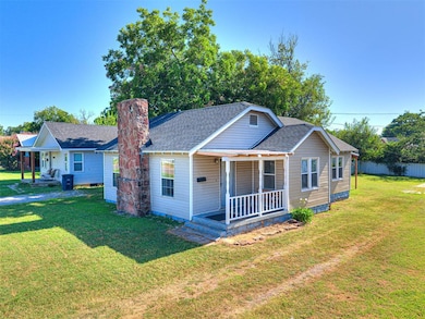 Classic 1930s character meets modern updates, including a 2024 roof and fresh exterior finishes. The fenced yard and shaded setting make this home ideal for simple, low-maintenance living.