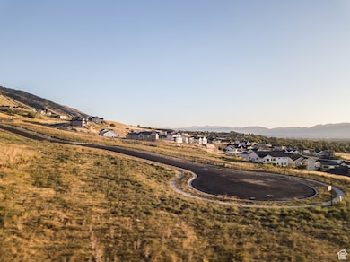 View of mountain backdrop featuring nearby suburban area