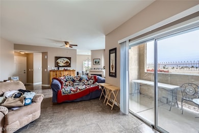 Bedroom with baseboards, a ceiling fan, and access