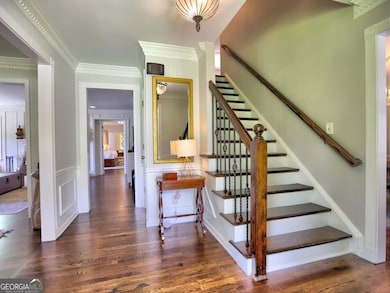 Welcoming foyer with gleaming hardwood floors throughout.