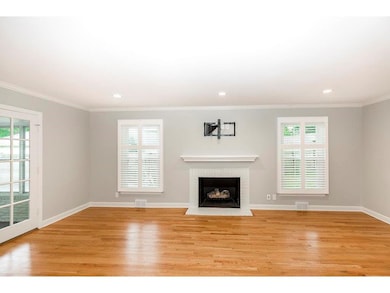 1st floor family room with fireplace overlooks bac