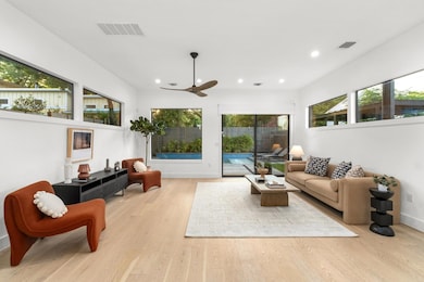 Living room featuring recessed lighting, light wo