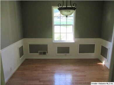 Formal dining room has hardwood and picture mold p