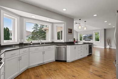 Huge picture window with side windows overlooking maintenance free deck.