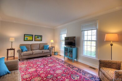 Fabulous living room with hardwood floors, crown m
