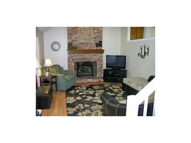Cozy Living Room with gas logs and brick fireplace