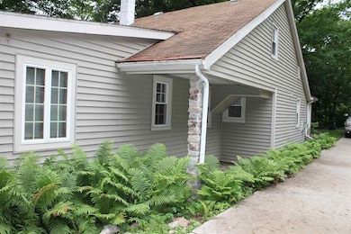 Hostas and Ferns line the driveway.